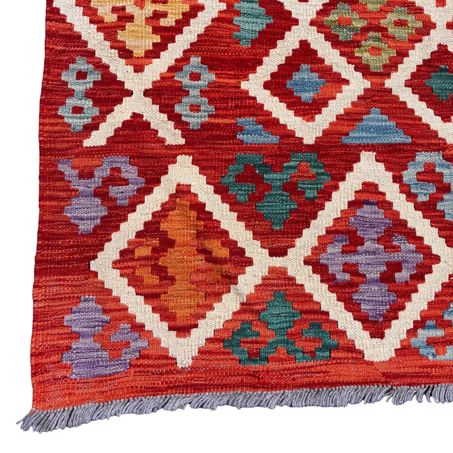 Corner detail showing intact fringe and tight weave