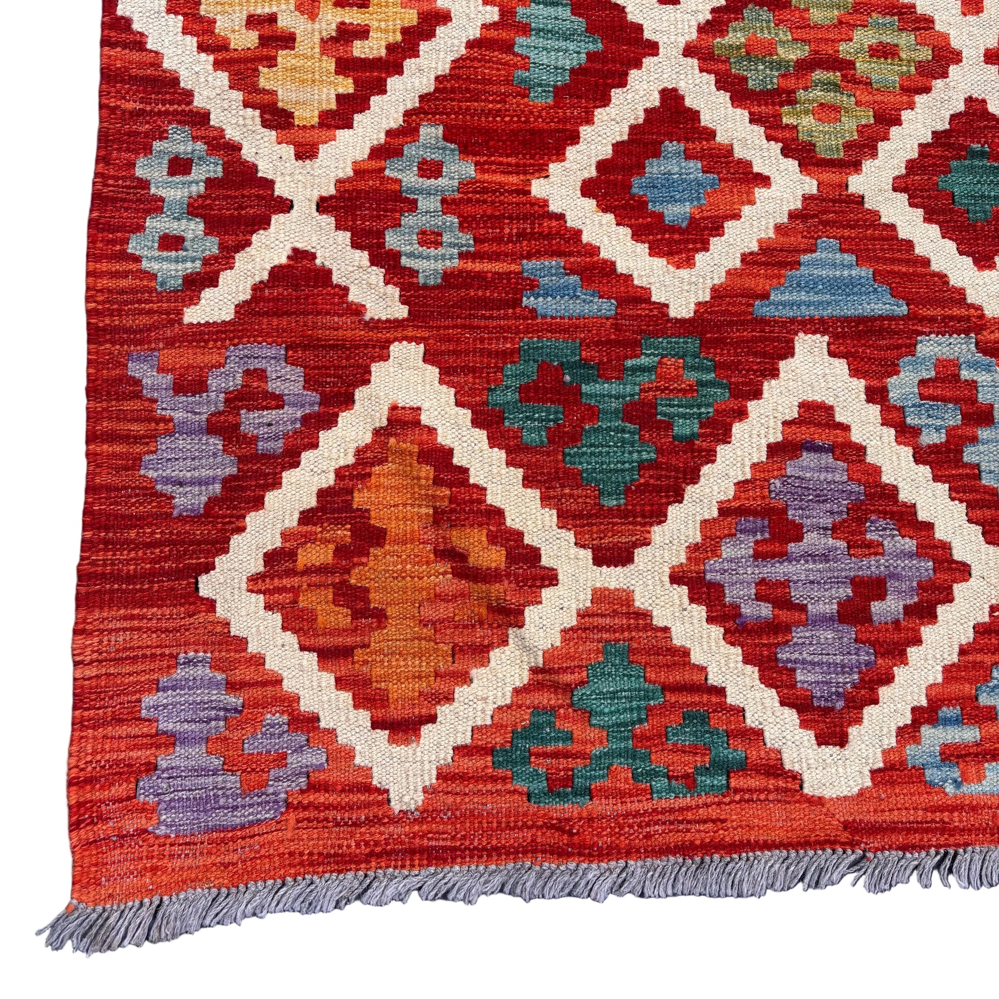 Corner detail showing intact fringe and tight weave
