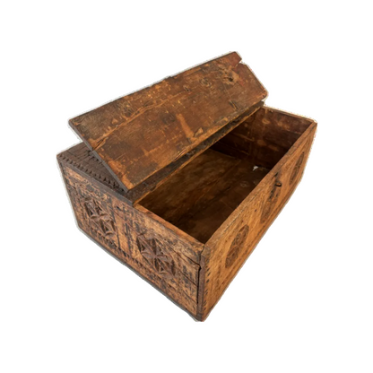Top view of antique carved wooden dowry box with forged iron carry handle and oxidised strapwork