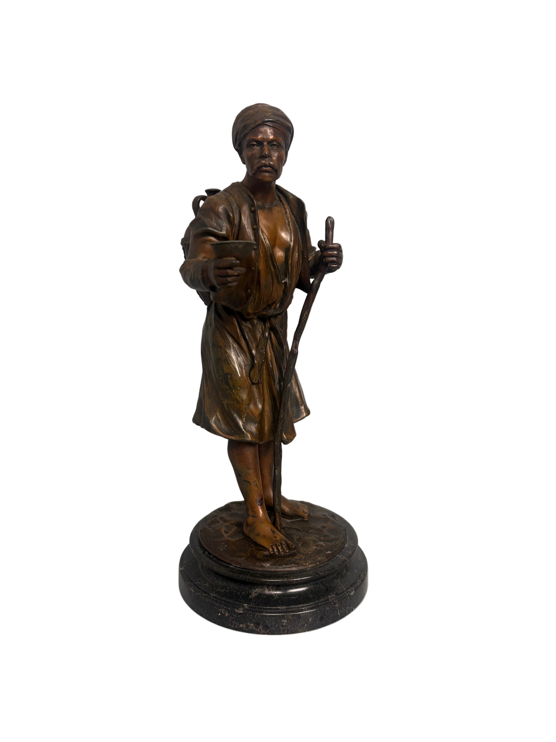 Late 19th-century bronzed metal figure of an Arabian water carrier on a black marble base.