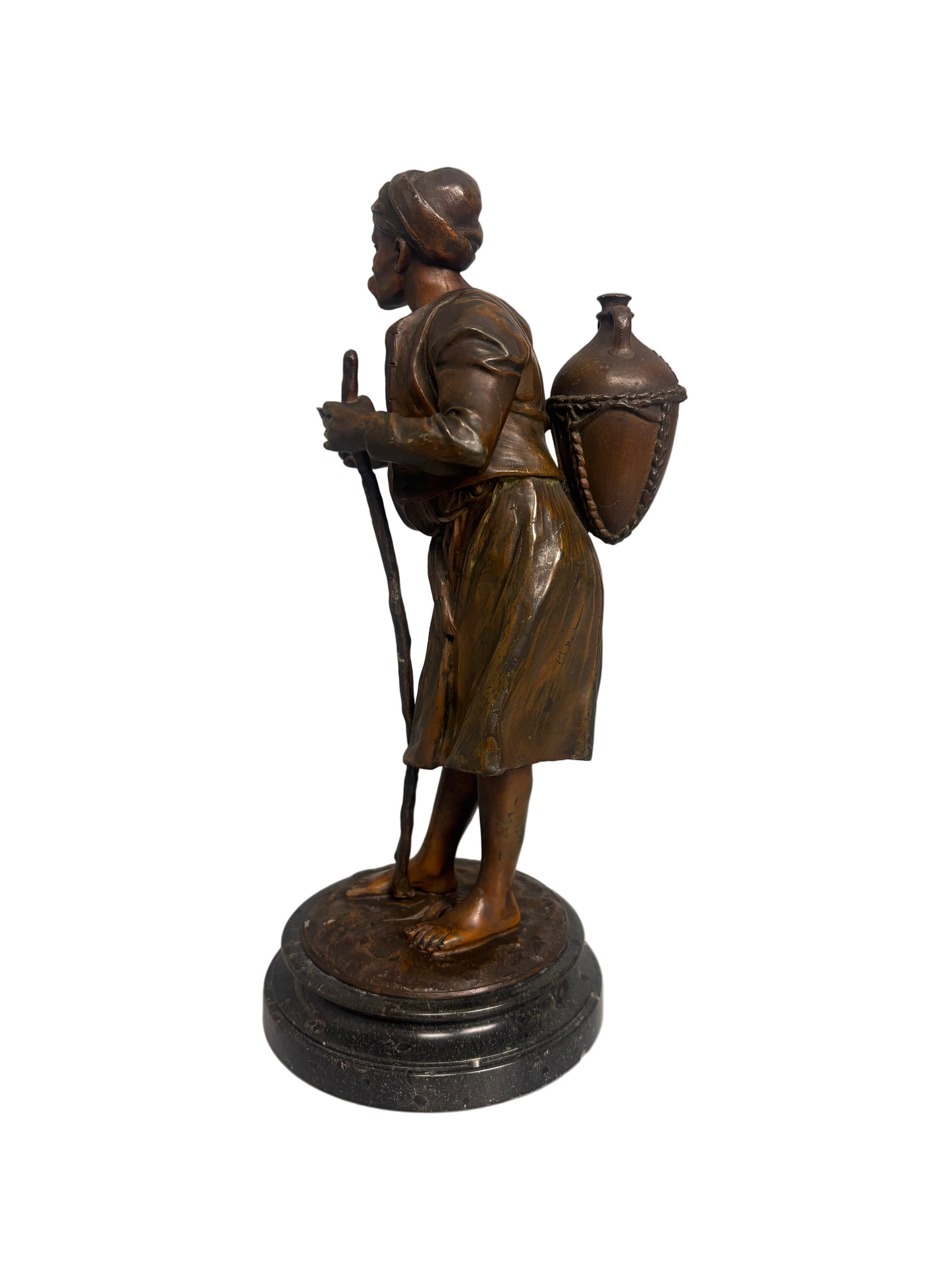 Late 19th-century bronzed metal figure of an Arabian water carrier on a black marble base.