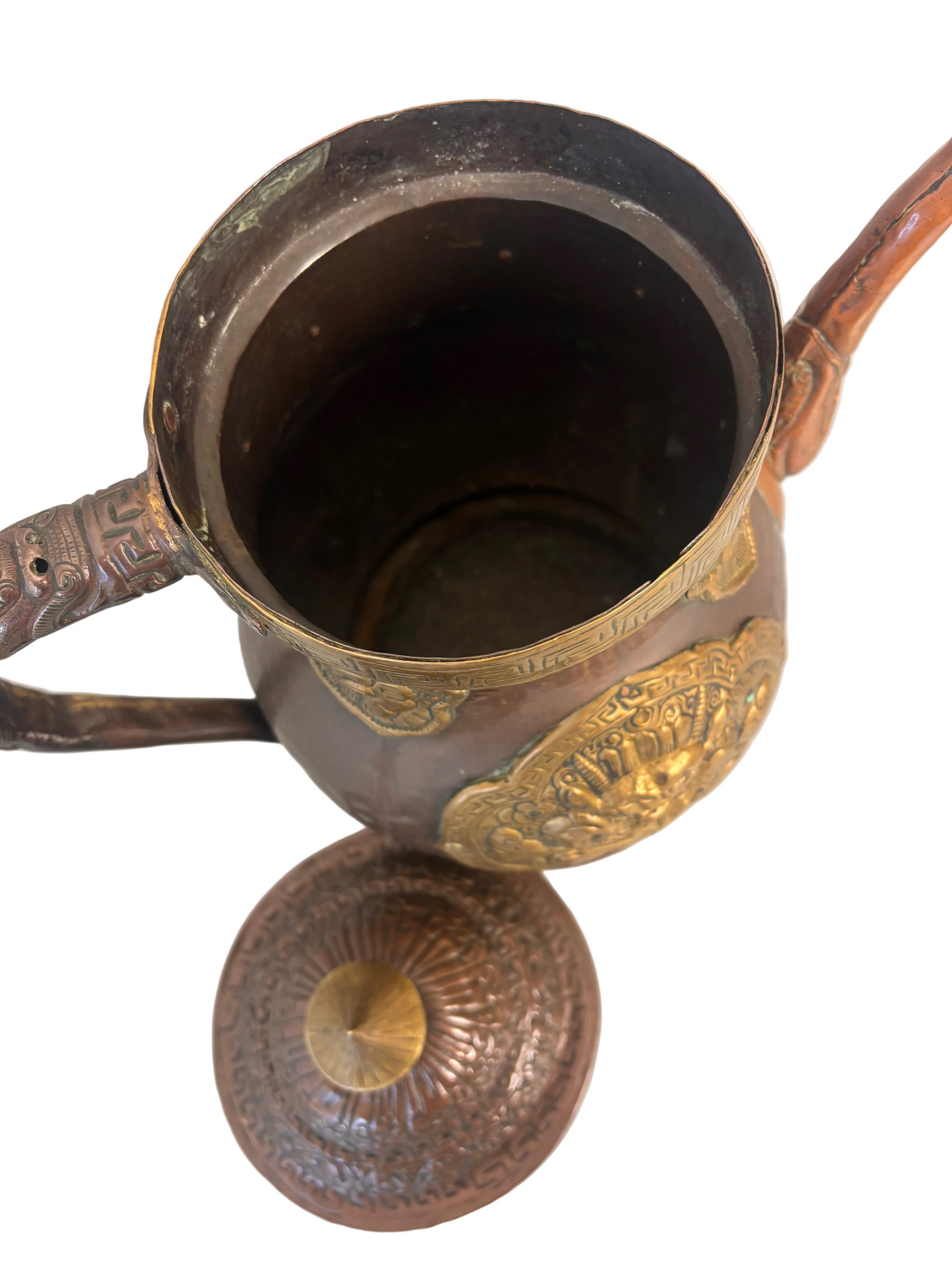 Copper and gilt-brass repoussé Sino-Tibetan style ewer with turquoise inlay and dragon mask medallion, domed lid and spout.