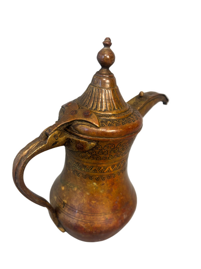Antique Middle Eastern Bedouin brass dallah coffee pot with engraved decoration and domed lid