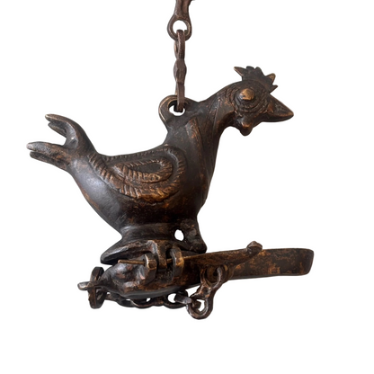 Antique Indian bronze bird-form hanging oil burner with decorative chain, late 19th to early 20th century, showing aged patina and hand-cast detailing.