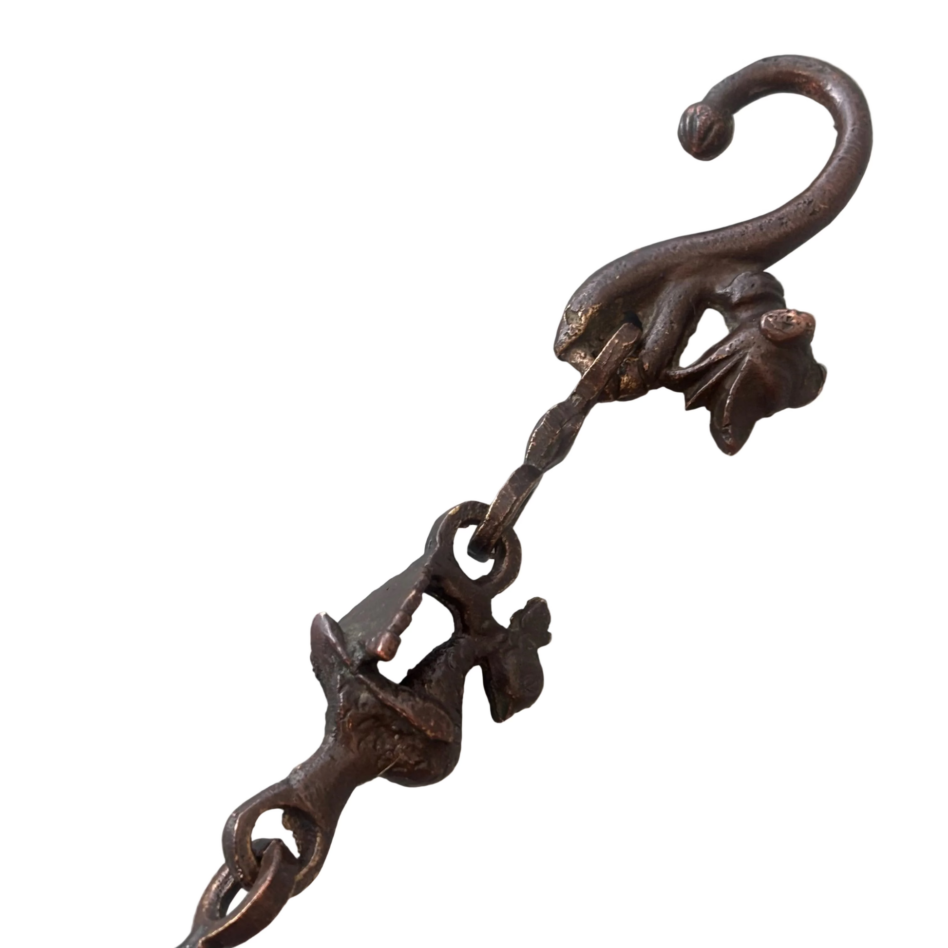 Decorative metal hook with a chain on a white background