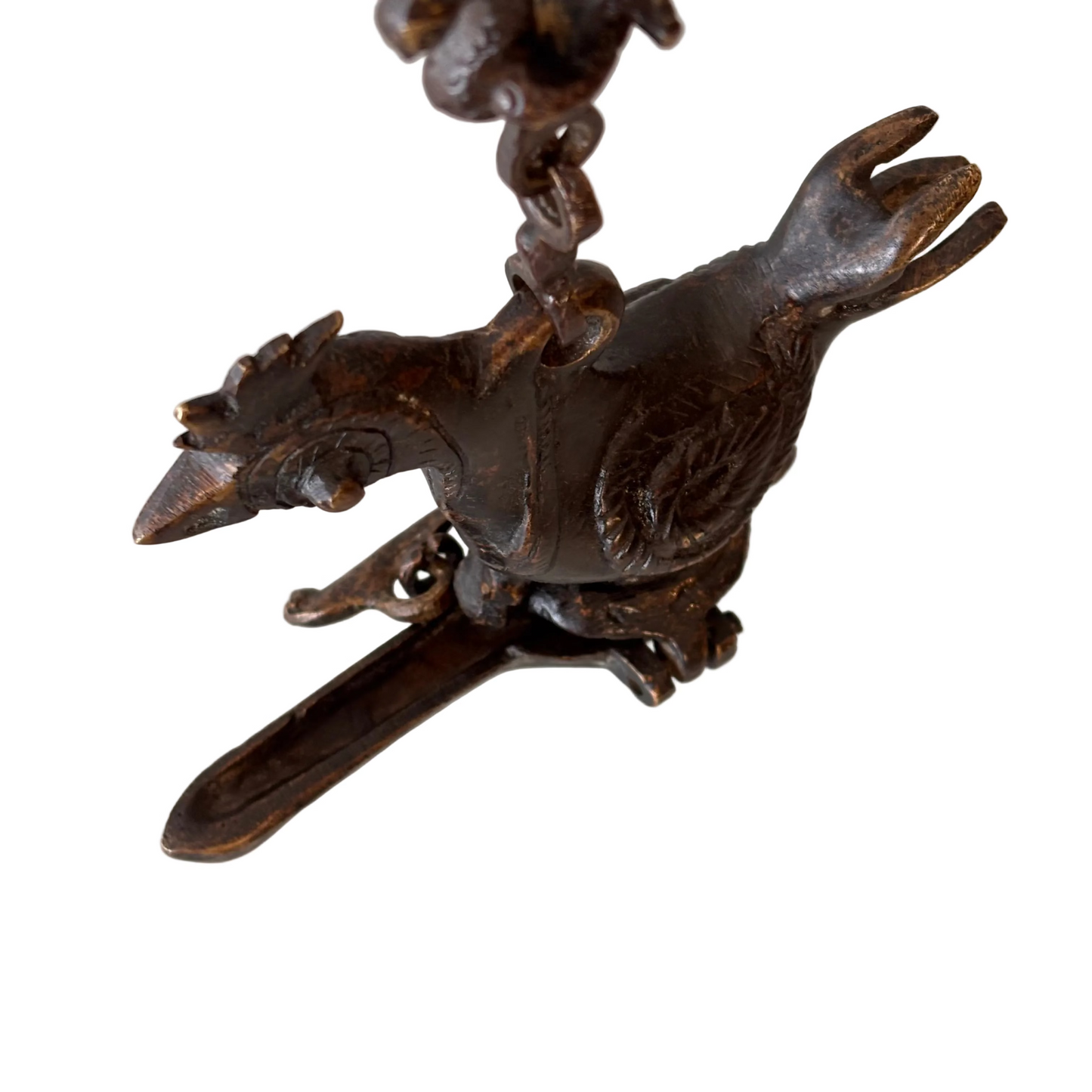 Antique Indian bronze bird-form hanging oil burner with decorative chain, late 19th to early 20th century, showing aged patina and hand-cast detailing.