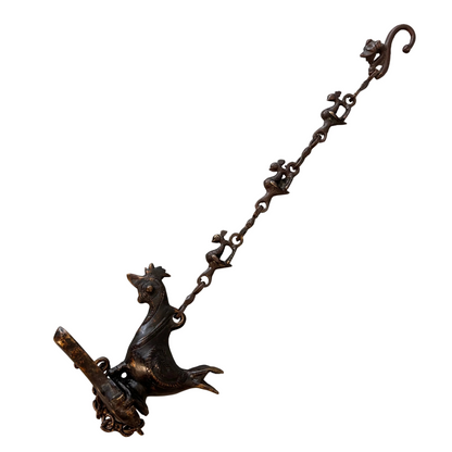 Antique Indian bronze bird-form hanging oil burner with decorative chain, late 19th to early 20th century, showing aged patina and hand-cast detailing.