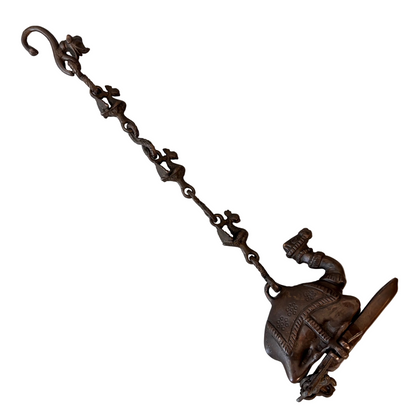 Antique Indian bronze camel oil lamp with suspended figural chain, late 19th century