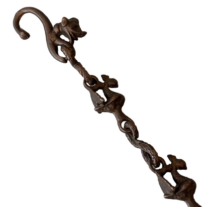 Antique Indian bronze camel oil lamp with suspended figural chain, late 19th century