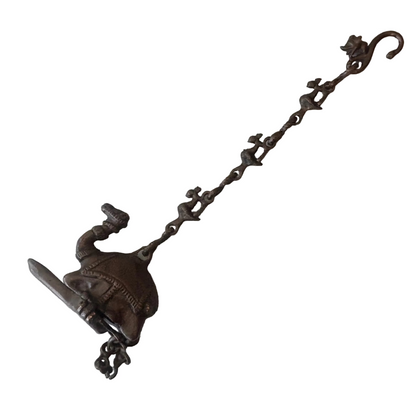 Antique Indian bronze camel oil lamp with suspended figural chain, late 19th century