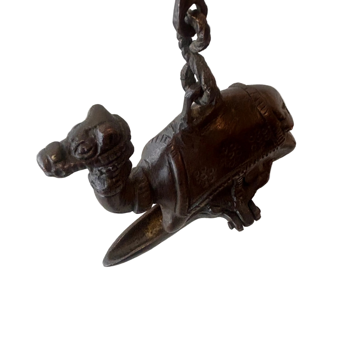 Antique Indian bronze camel oil lamp with suspended figural chain, late 19th century