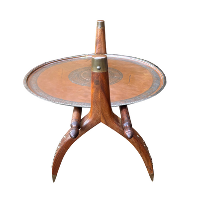Safavid Persian engraved copper tray with calligraphic medallion on mid-century Indian camel saddle wooden stand