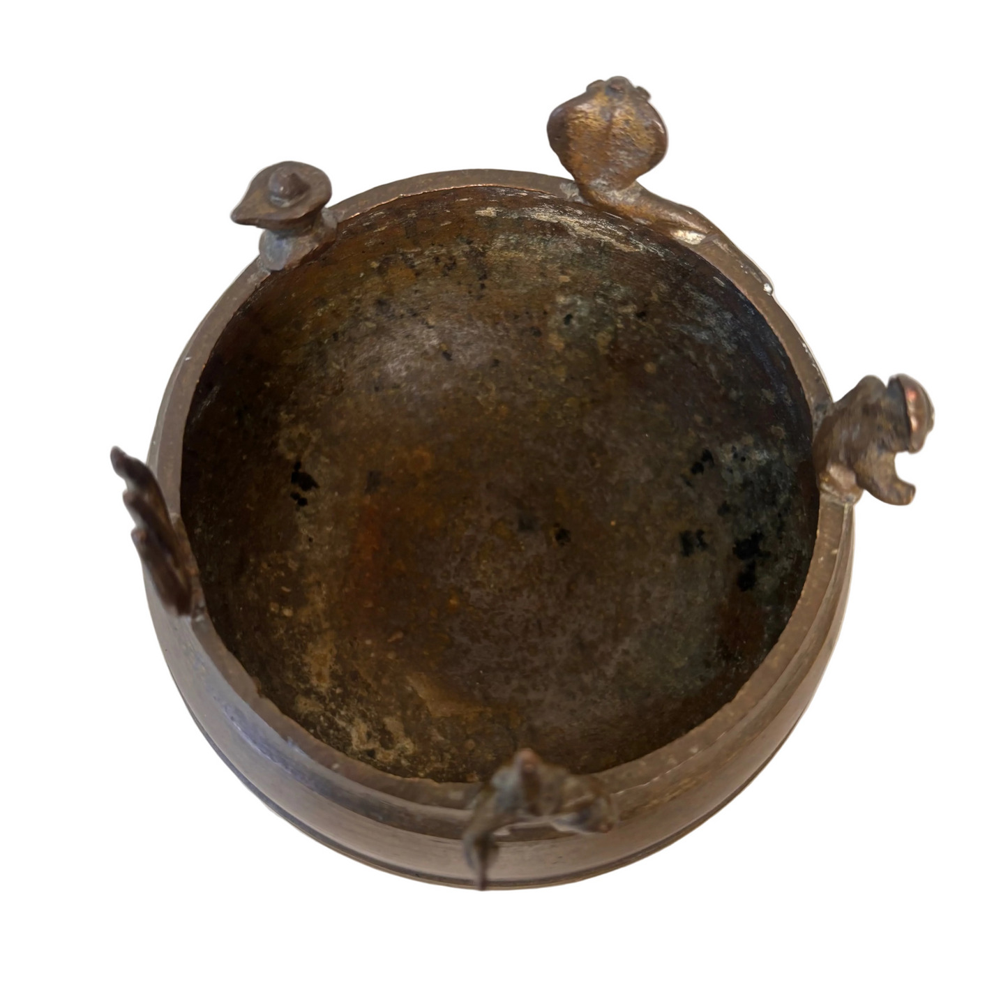 Interior of South Indian brass Thirtham Kinnam ritual vessel showing patina from use
