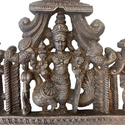 Detail of Lord Murugan holding vel spear on peacock