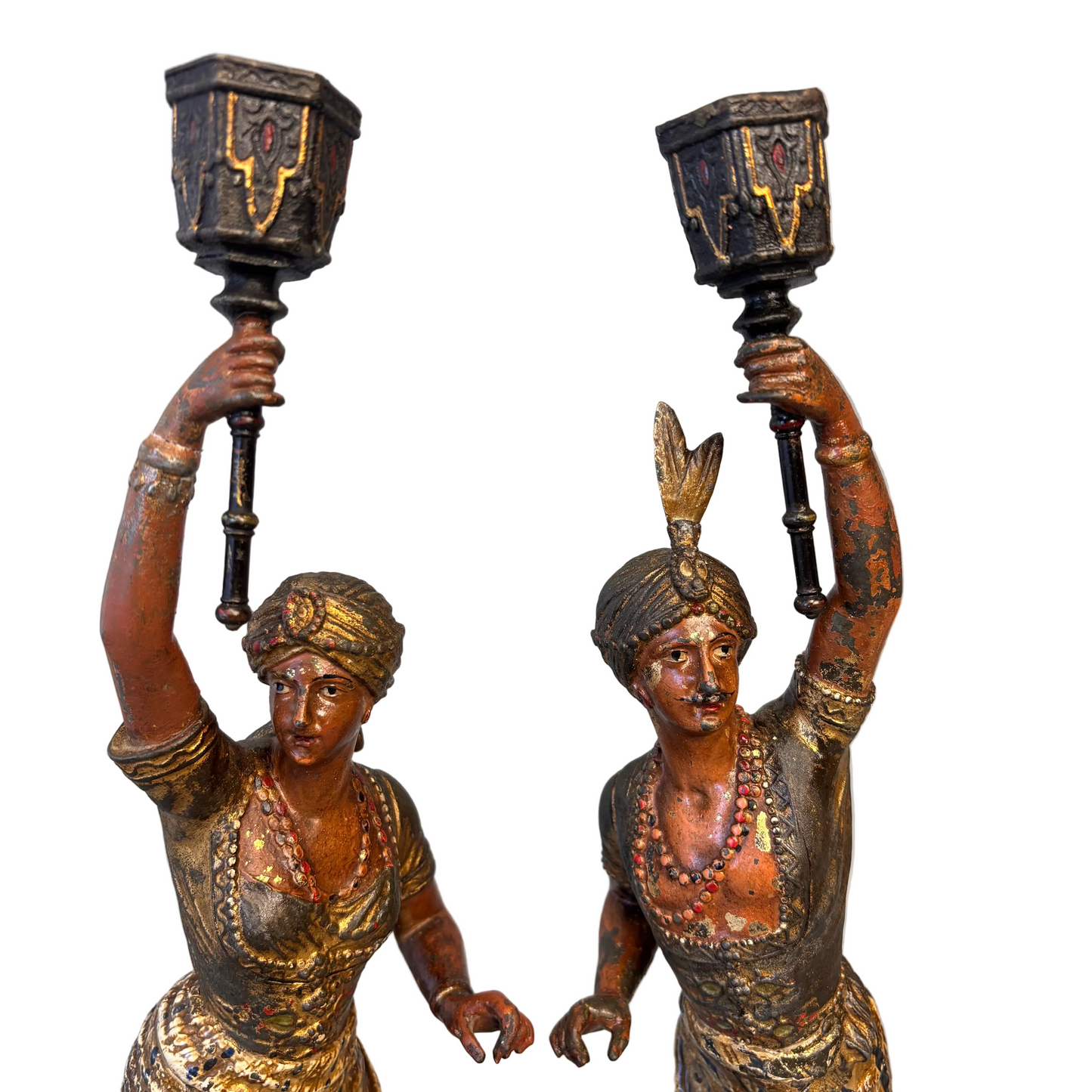Close-up detail of faces and costume on 19th century Orientalist spelter figures