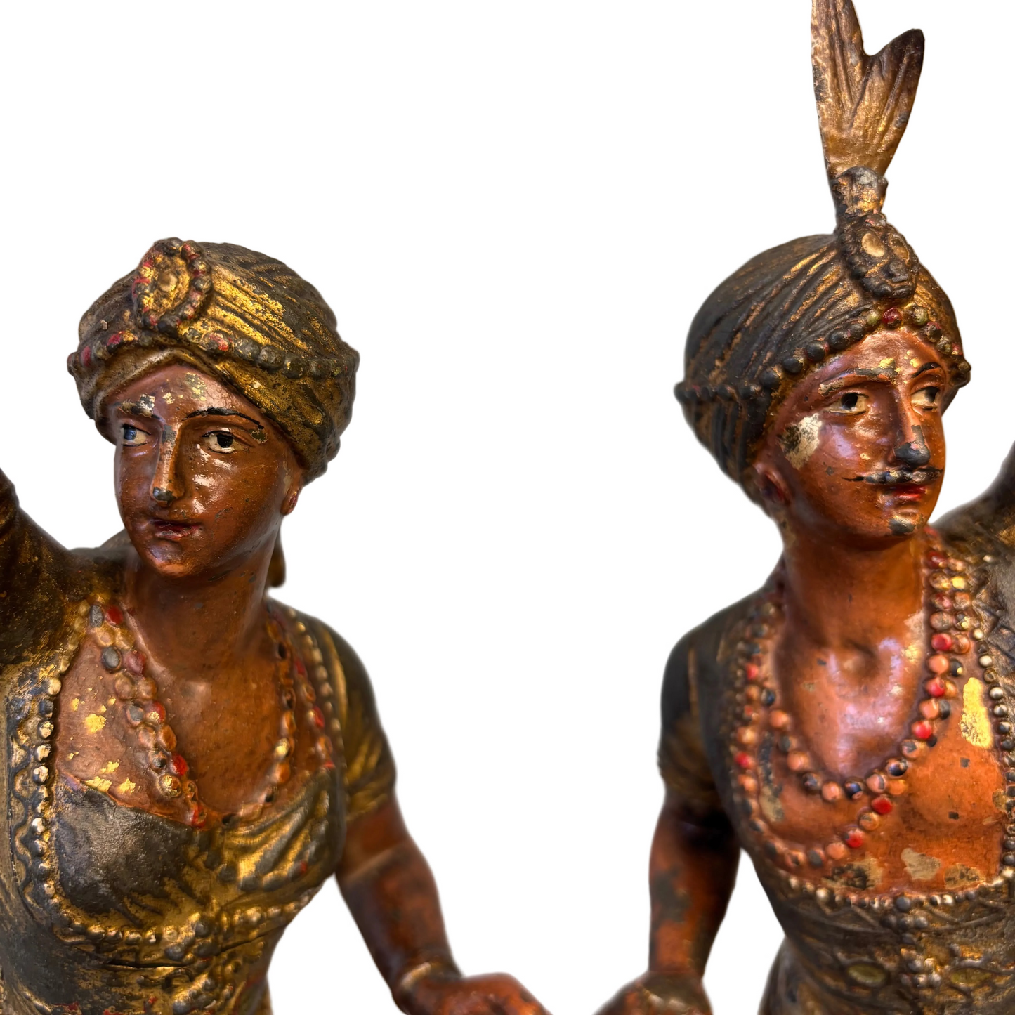 Close-up detail of faces and costume on 19th century Orientalist spelter figures