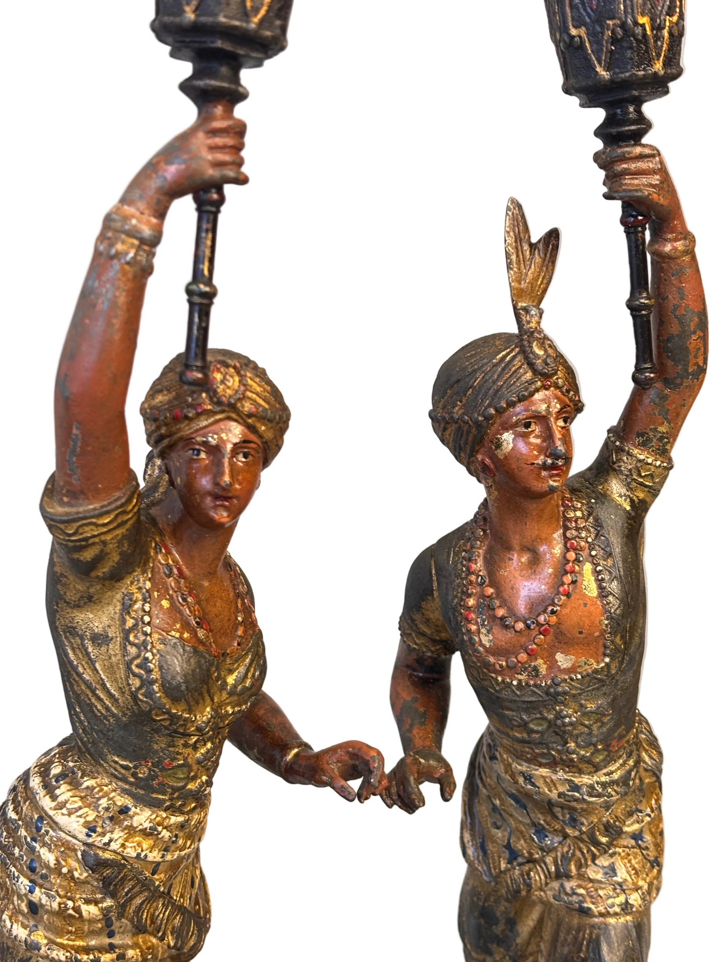 Close-up detail of faces and costume on 19th century Orientalist spelter figures