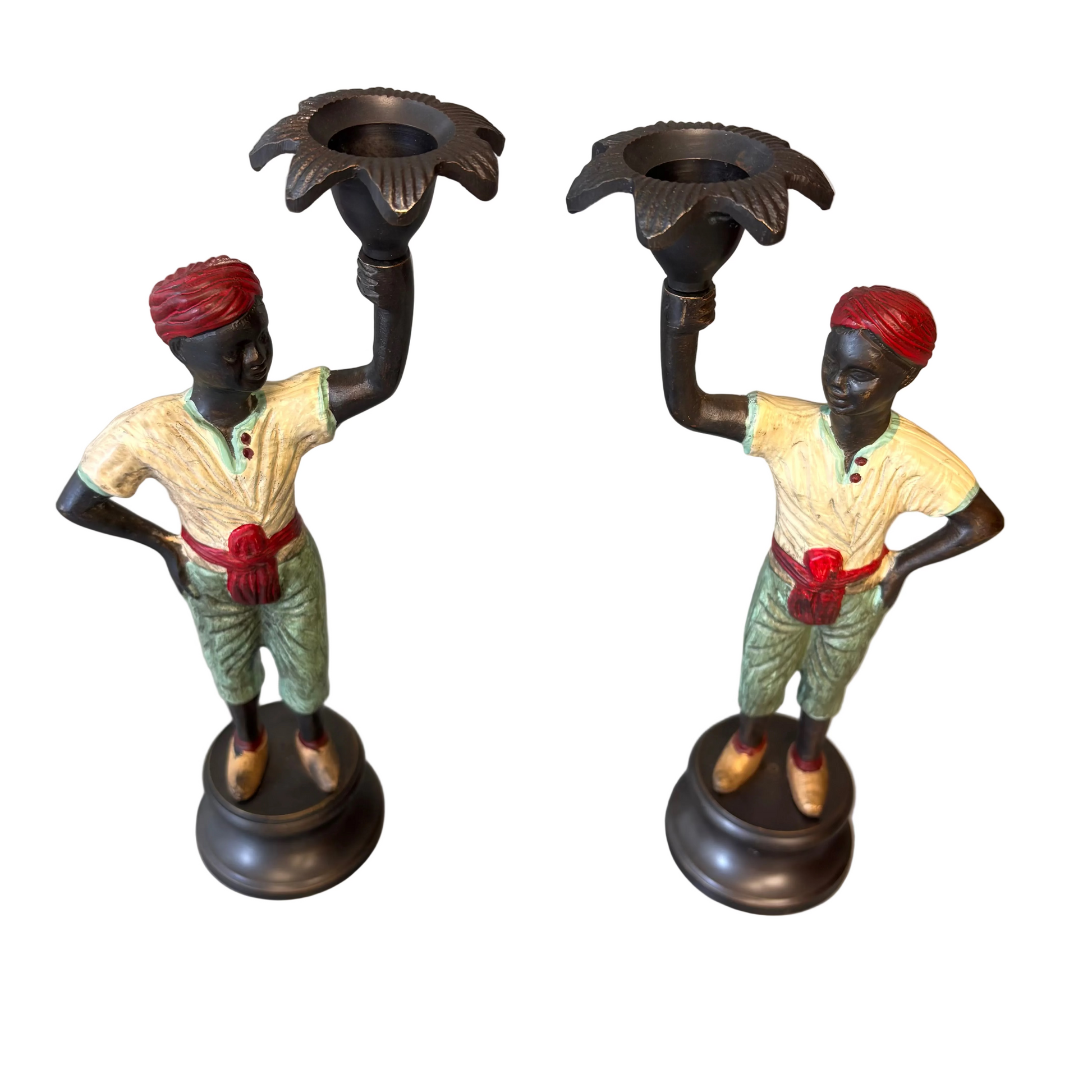 Pair of early 20th century polychrome figural candlesticks with red turbans and flower-form candle cups on circular bases