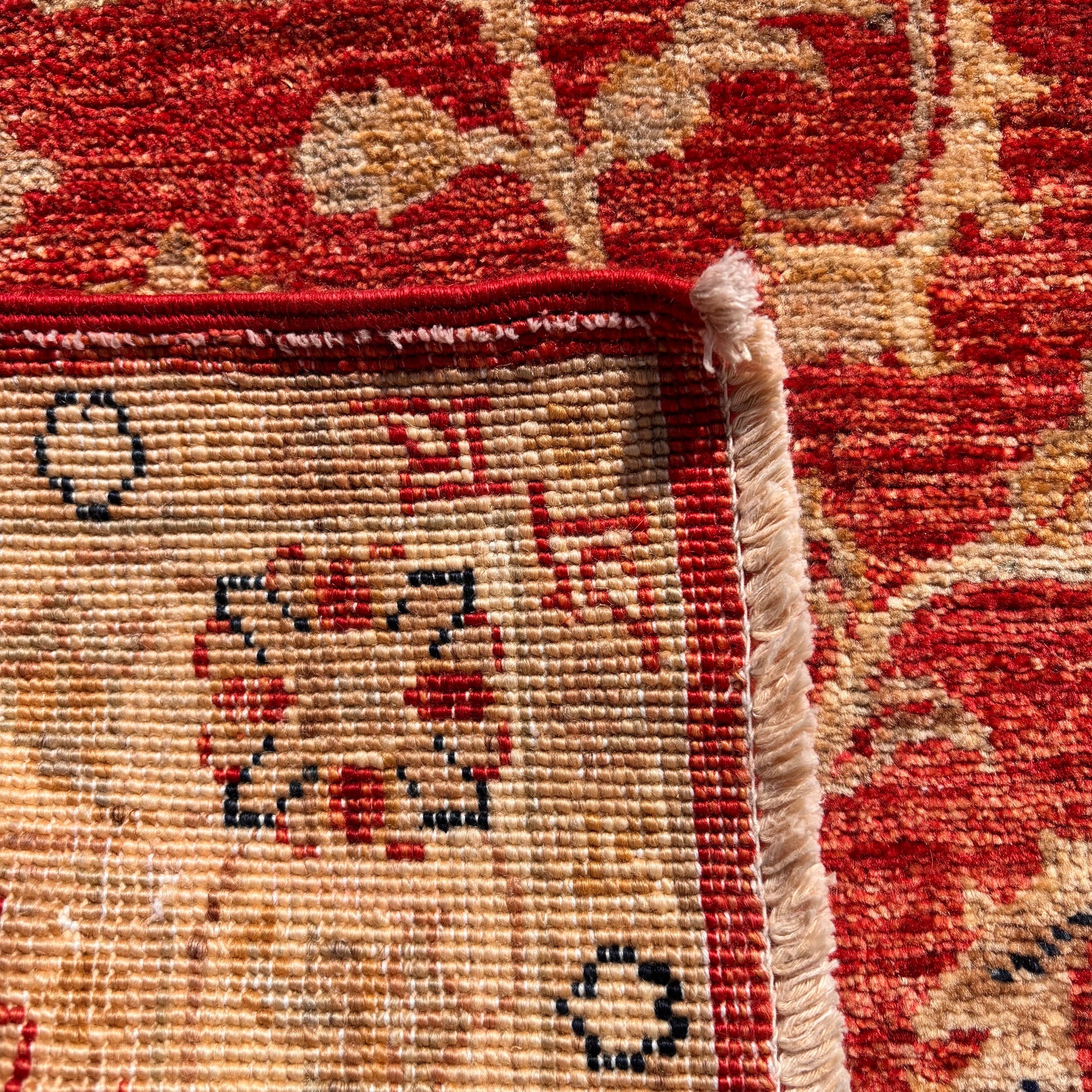 Reverse of hand knotted Ziegler rug showing tight weave structure
