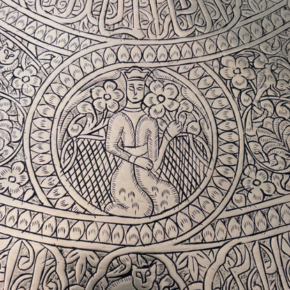 Close-up of Qajar style seated female figures on Persian engraved brass tray