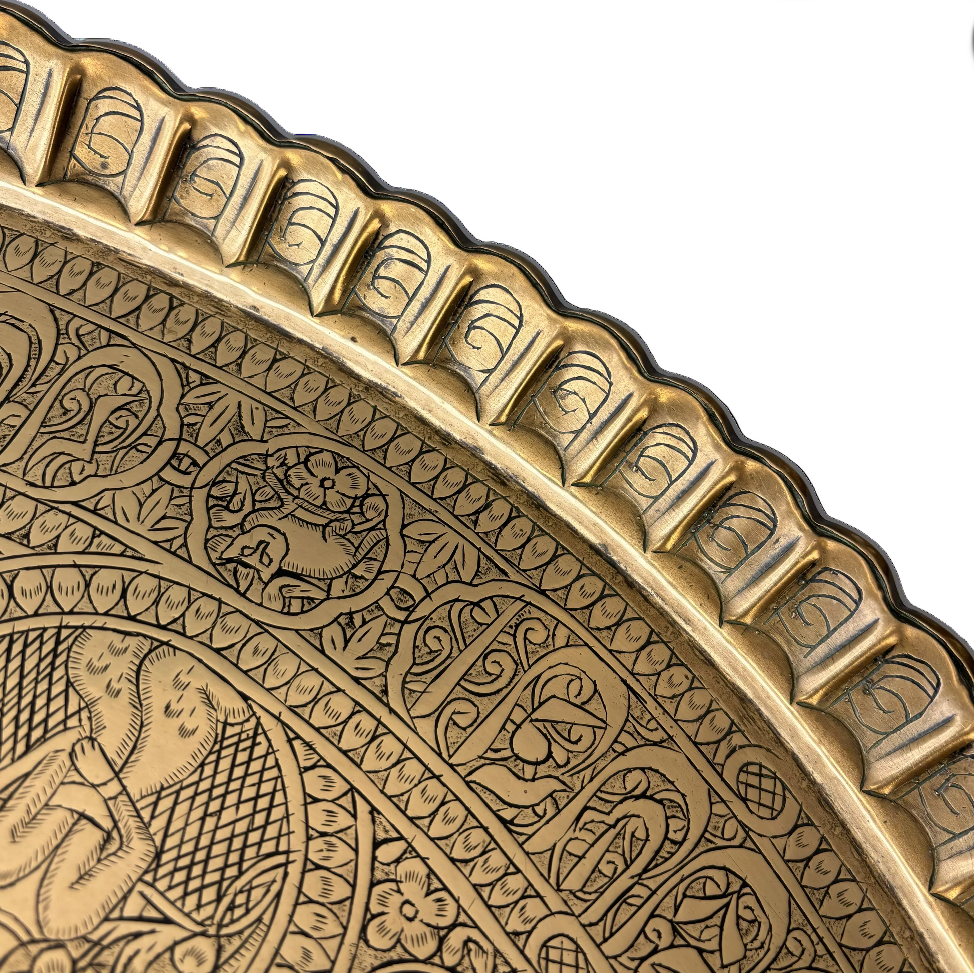 Scalloped rim detail on large Persian engraved brass wall charger
