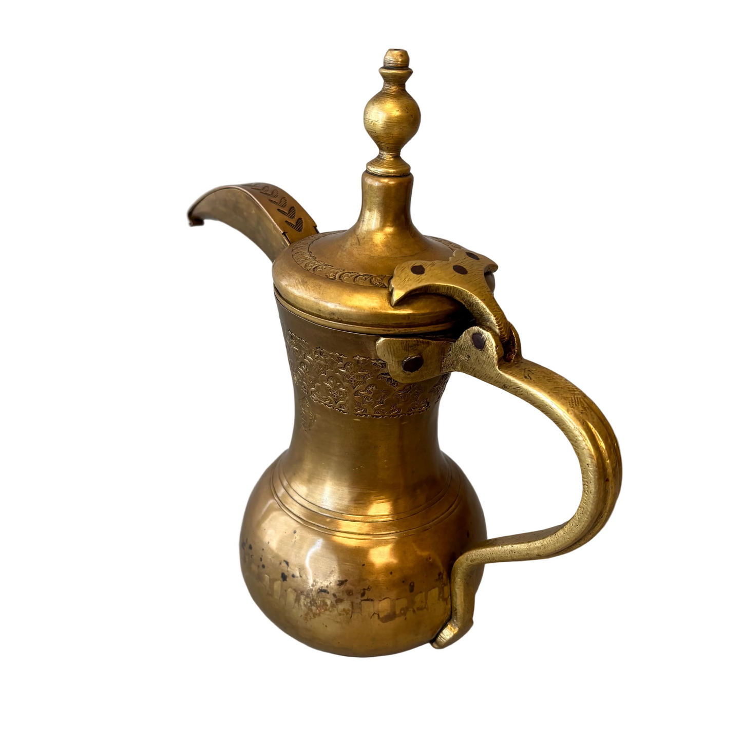 Hand-raised brass dallah showing curved spout and hinged lid detail