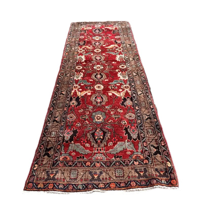 Persian Meshkin runner rug full length with red field and geometric medallions