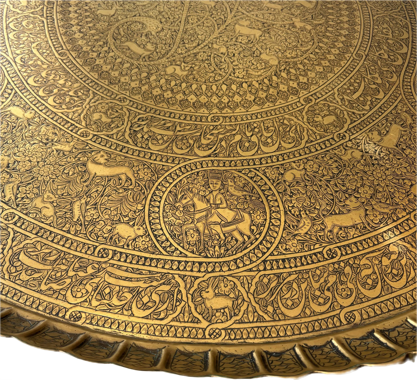 Equestrian figure detail on engraved Persian tray