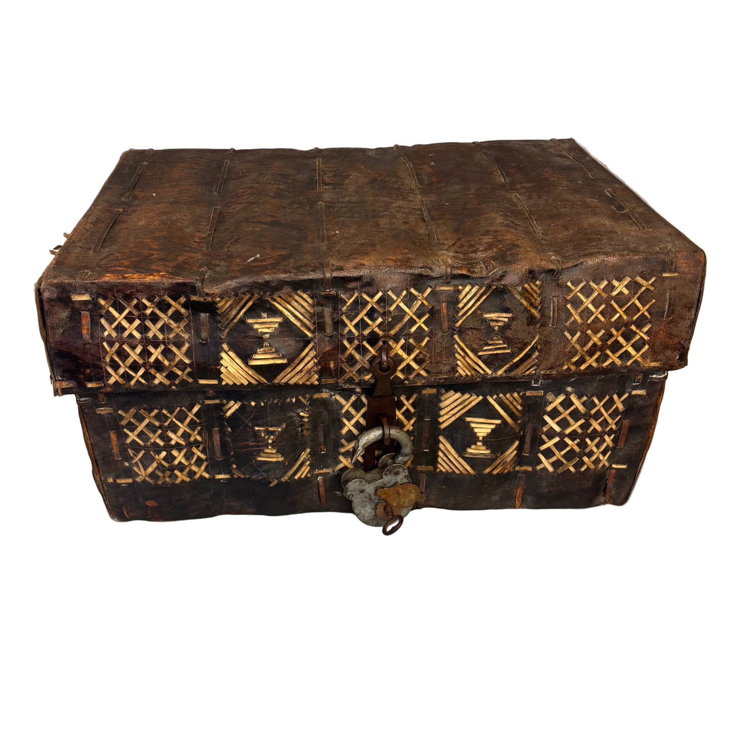 South American rawhide petaca chest with geometric leather strip decoration, front view