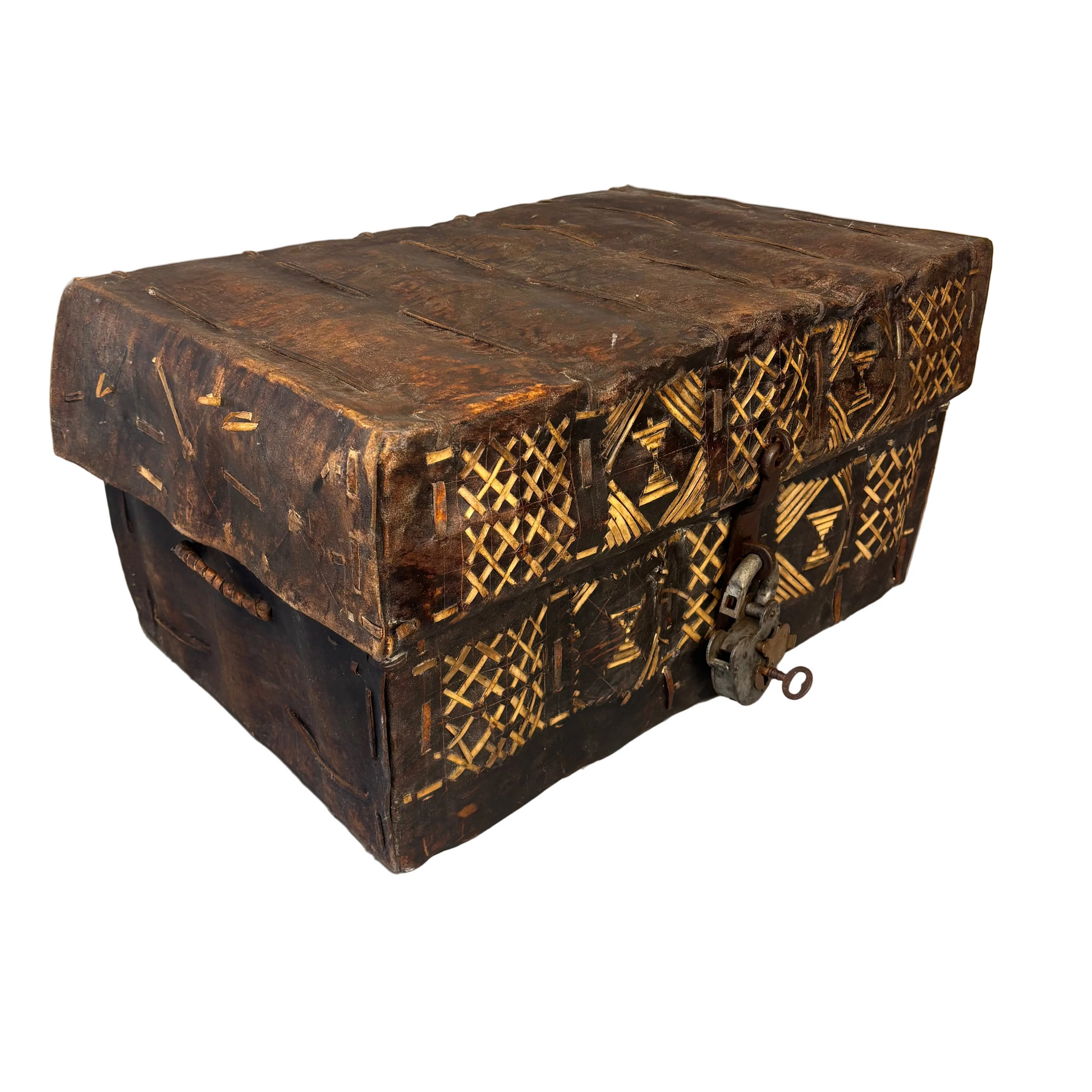 Angled view of antique South American hide trunk showing stitched construction and applied decoration