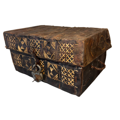 Side detail of rawhide petaca chest with wrapped leather handle