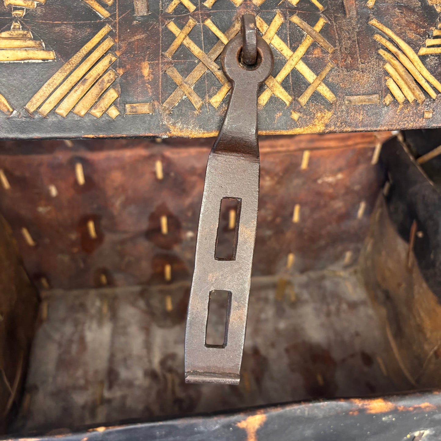 Close-up of Hand Forged Clasp, stitched structural hide construction and aged patina