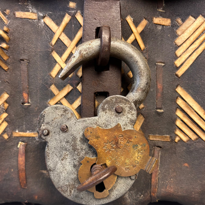 Close-up of padlock on petaca hide chest