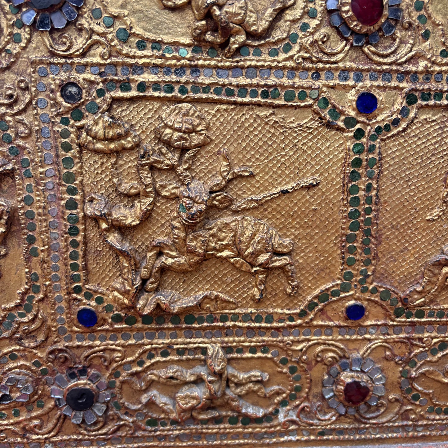 Close up view of narrative relief panels and thayo work.