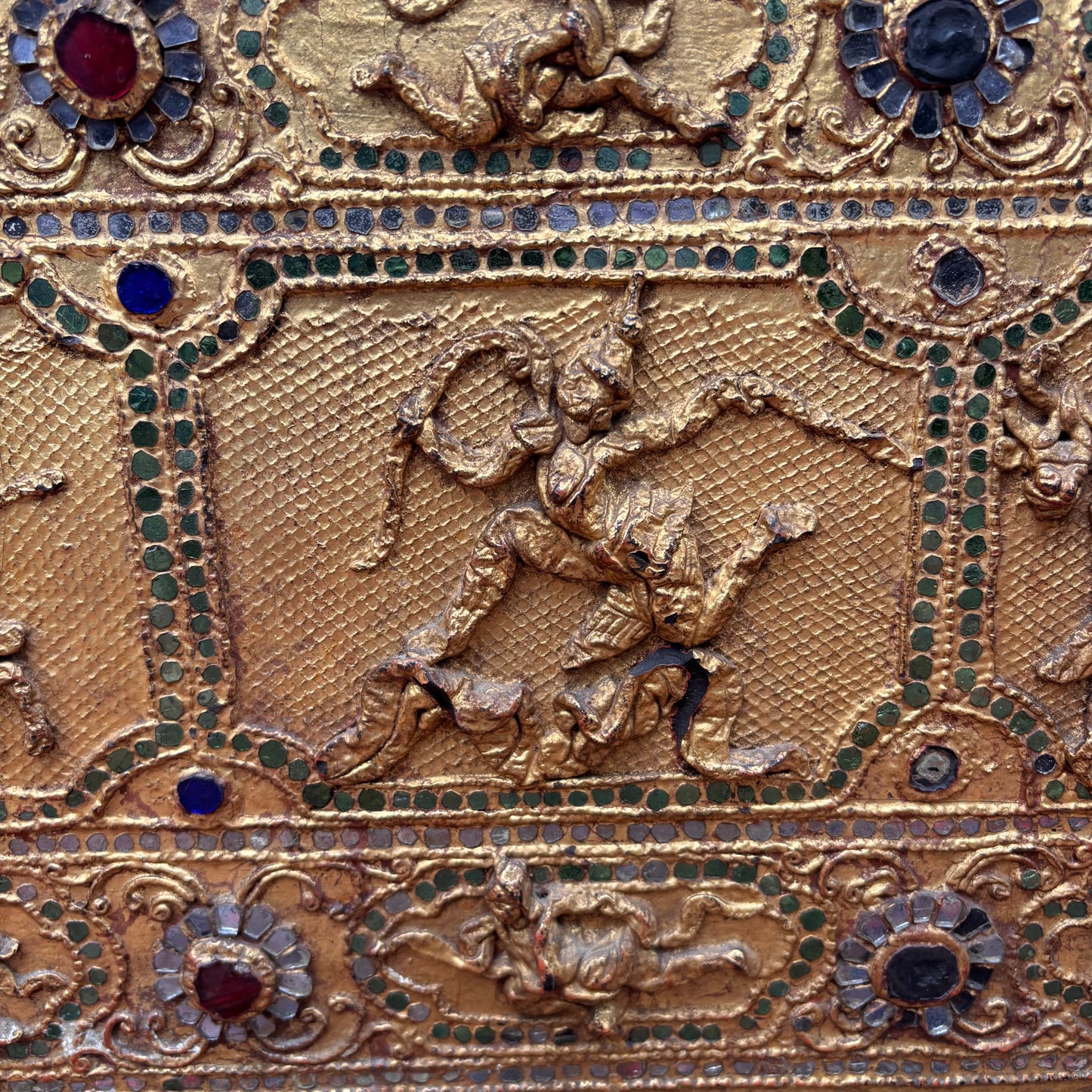 Close up view of narrative relief panels and thayo work.