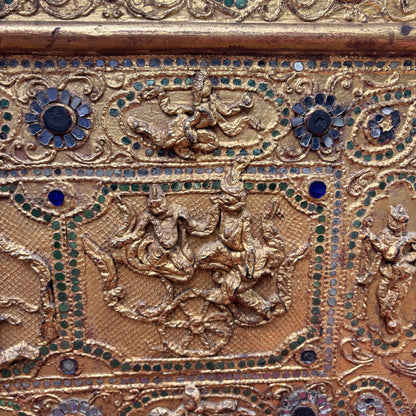 Close up view of narrative relief panels and thayo work.