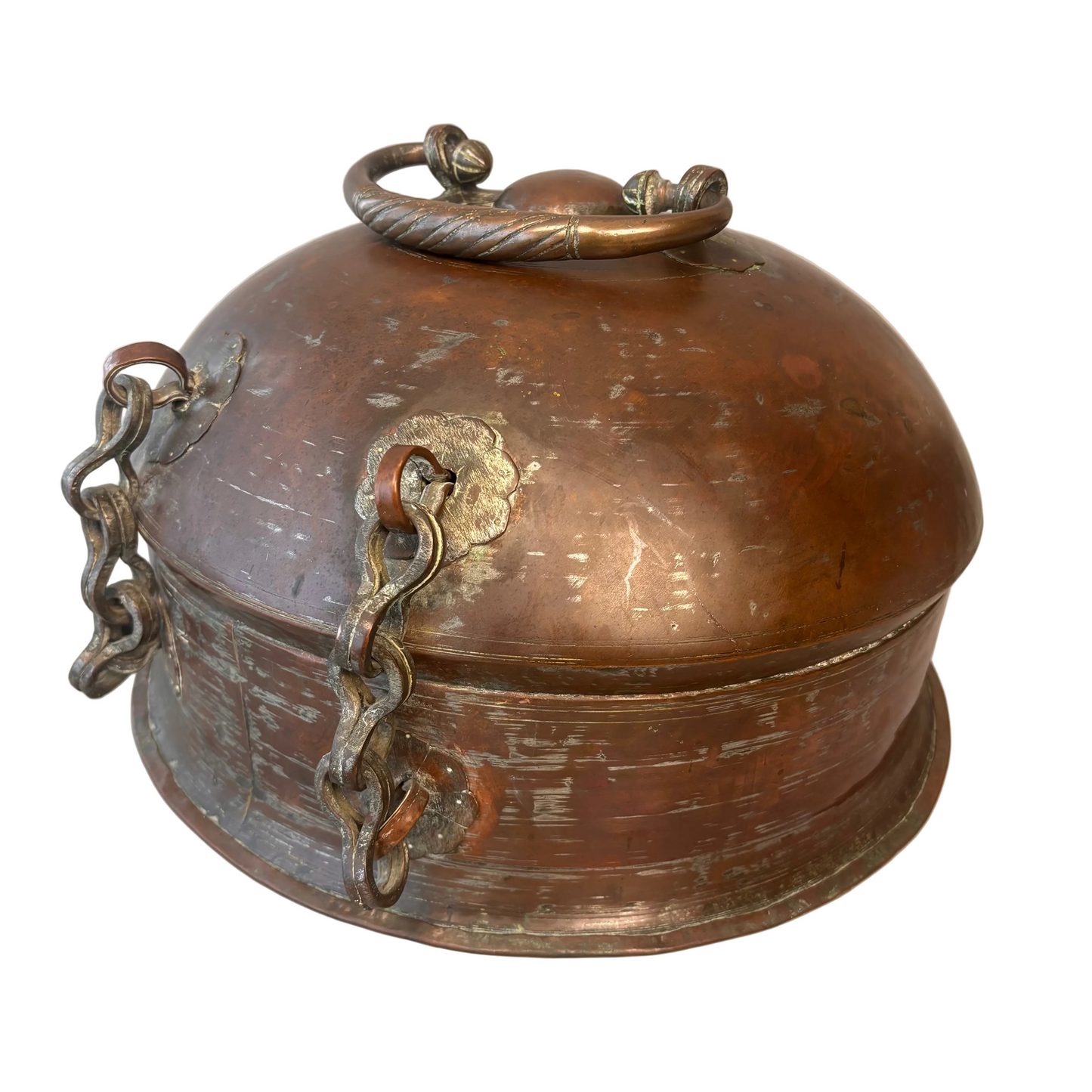 Side view showing original chain fittings and patinated copper surface