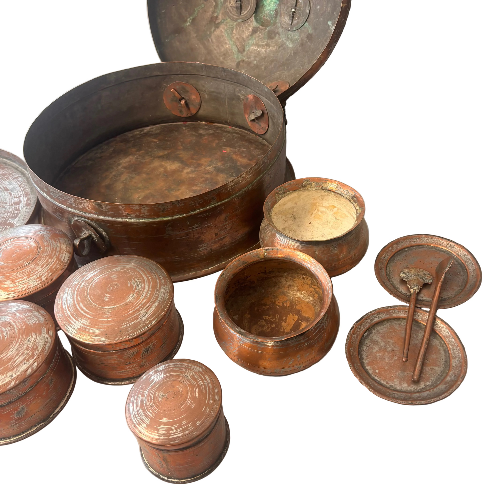 Close-up of internal copper pots with wear and patina