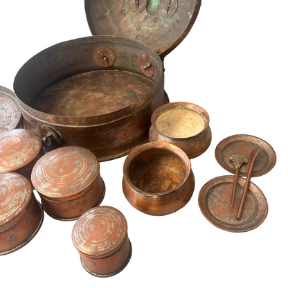 Close-up of internal copper pots with wear and patina