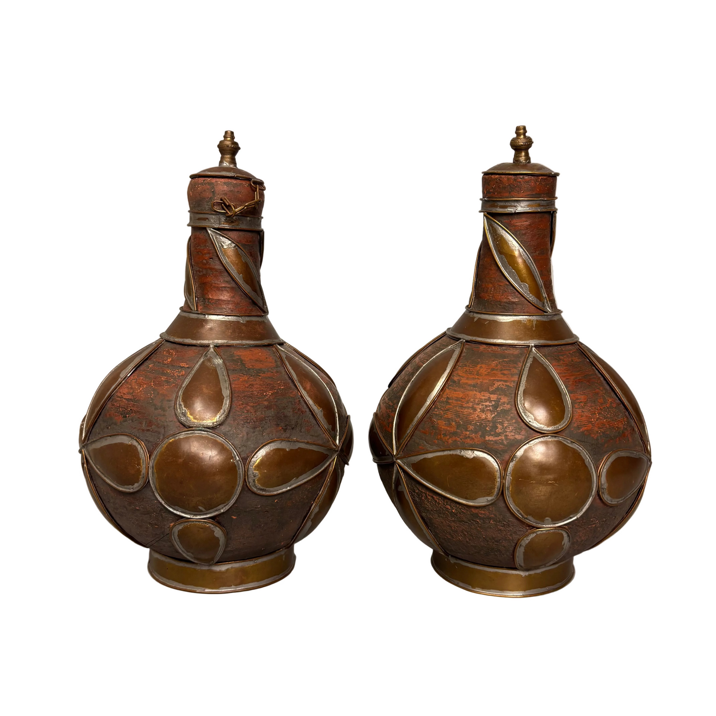 Rear view Moroccan qirba form pottery vessels with metal decoration