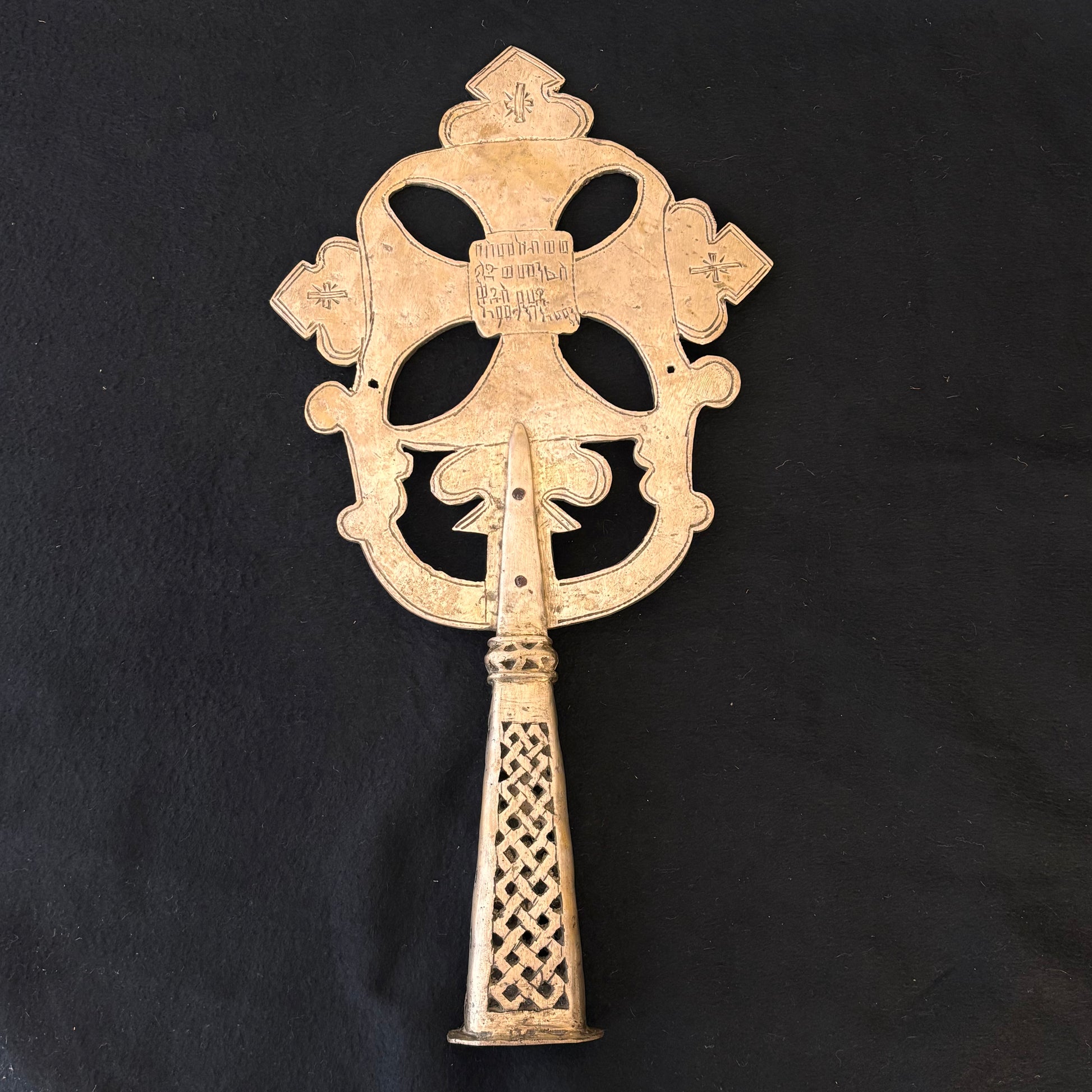 Hand-cut lattice handle on 19th century Ethiopian devotional cross