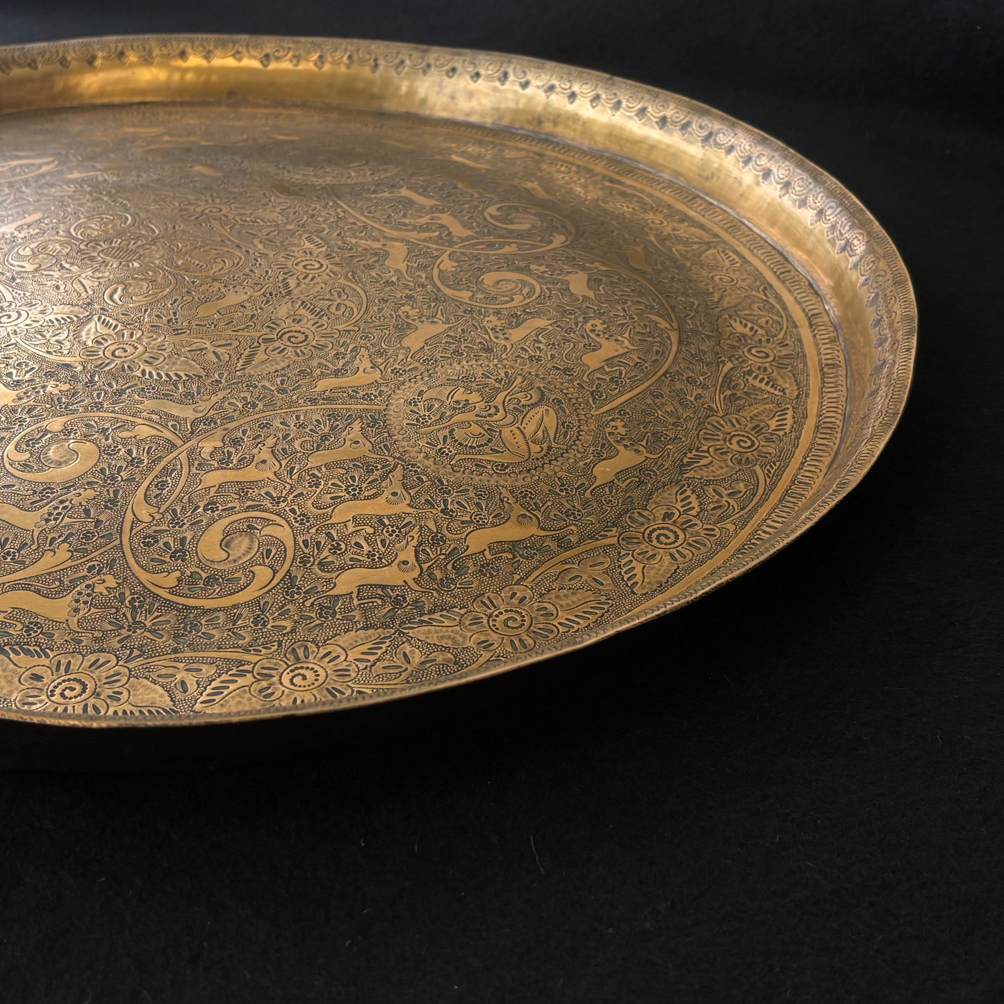 Detailed border engraving on Mughal Revival brass tray
