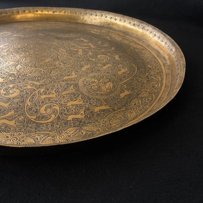 Detailed border engraving on Mughal Revival brass tray