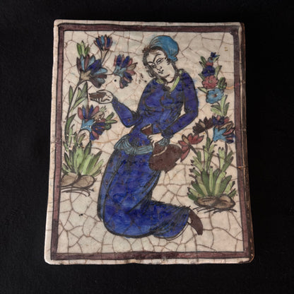 Antique Persian Qajar figural tile depicting kneeling female figure