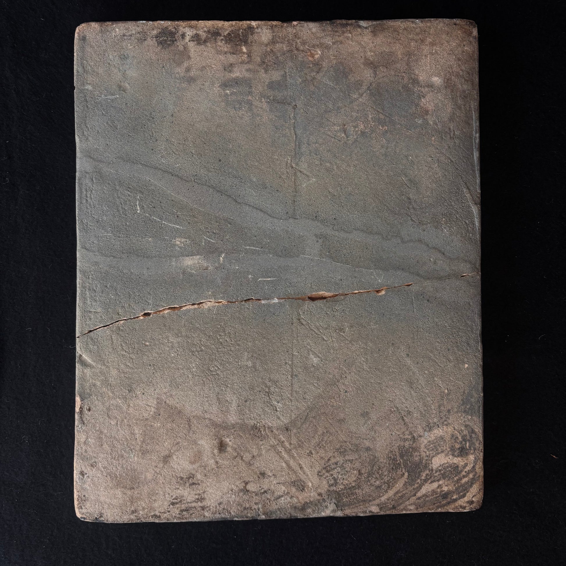 Reverse of antique Persian Qajar ceramic tile showing historic crack