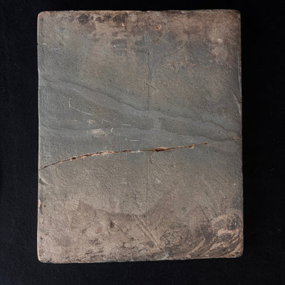 Reverse of antique Persian Qajar ceramic tile showing historic crack