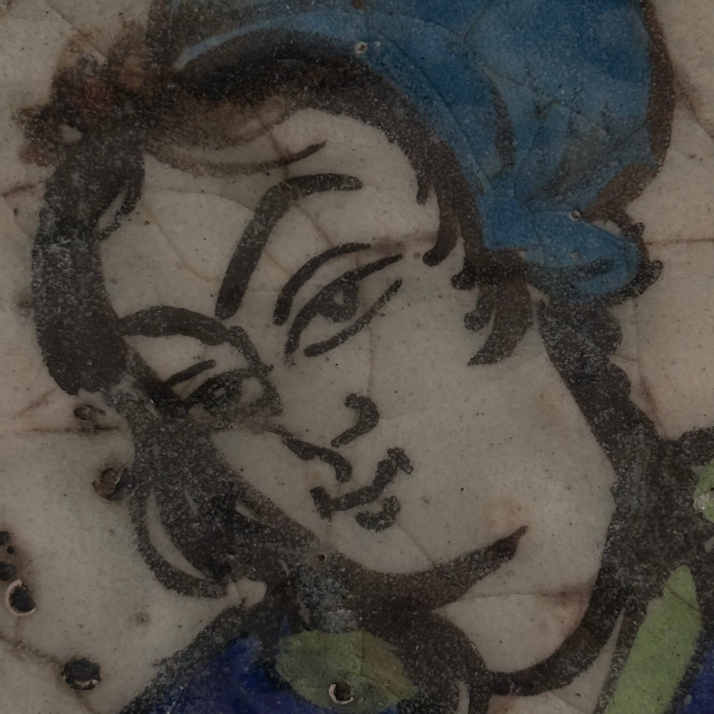 Close-up of female figure face on Qajar ceramic tile