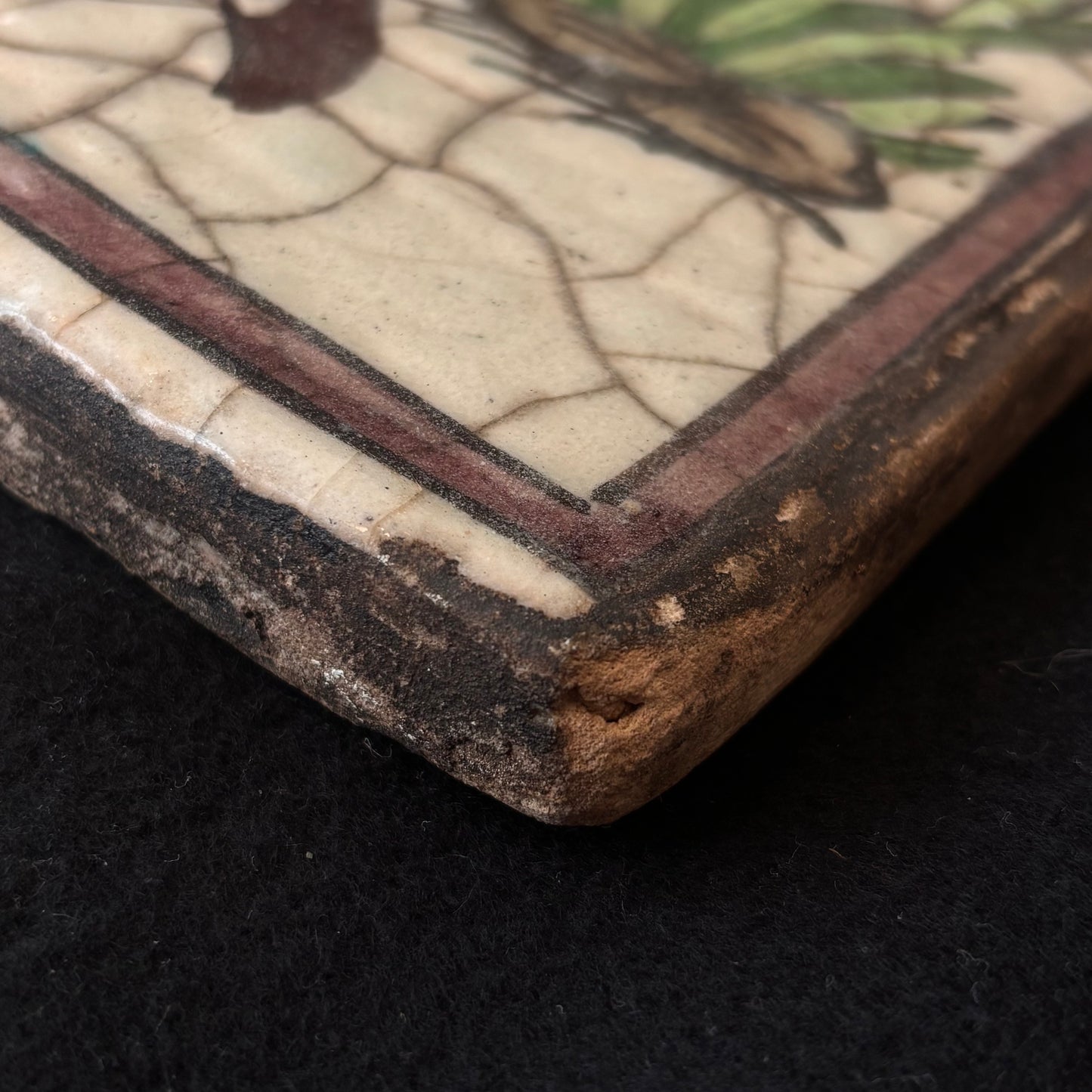 Corner detail showing glaze craquelure and age-related wear