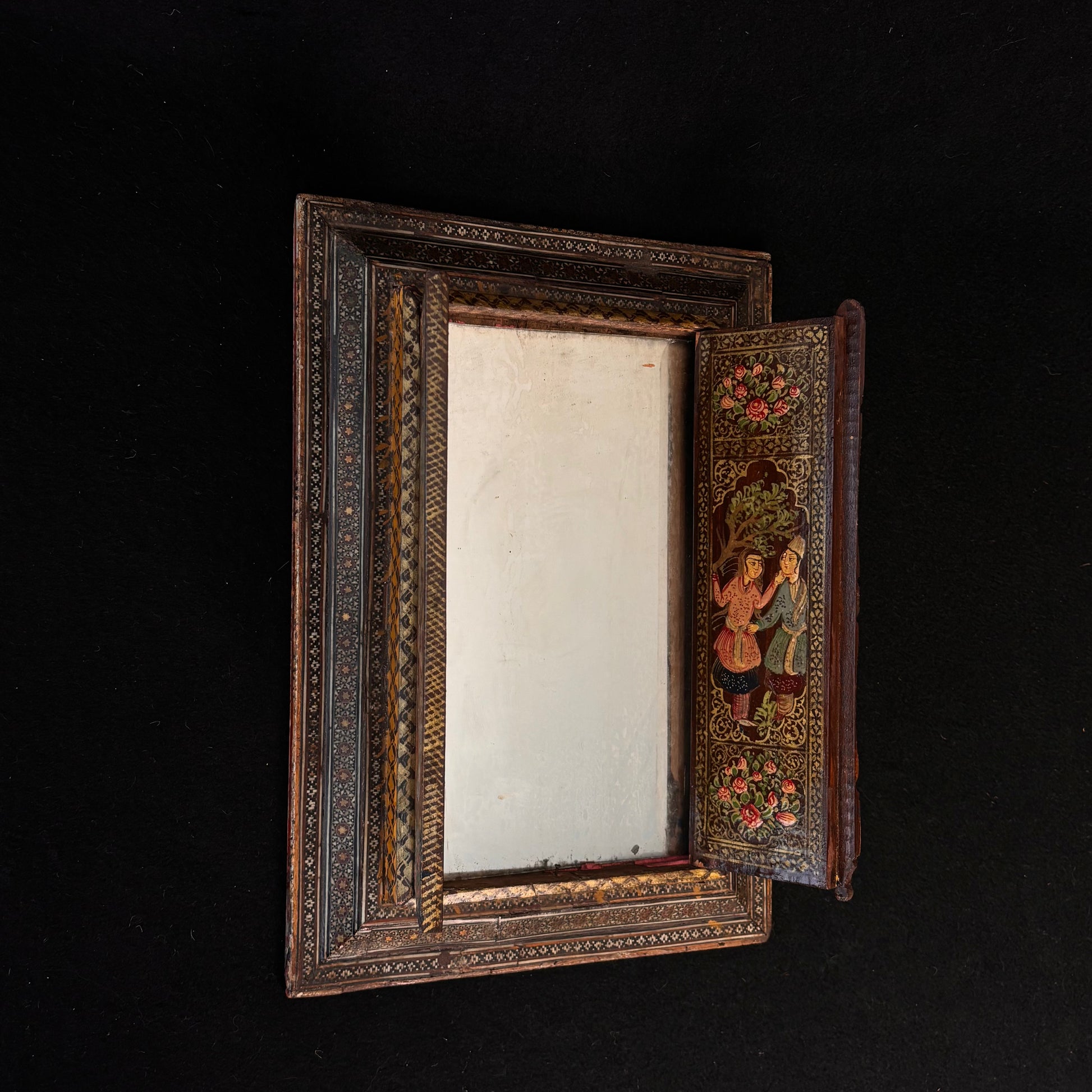 Persian Khatamkari mirror opened showing aged mirror plate and painted interior door