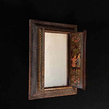 Persian Khatamkari mirror opened showing aged mirror plate and painted interior door